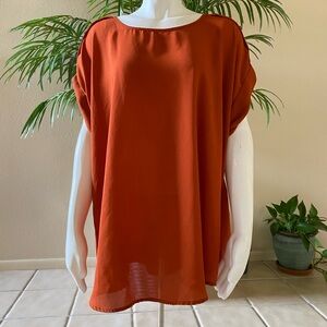 Orange silk blend blouse with short sleeves and button details